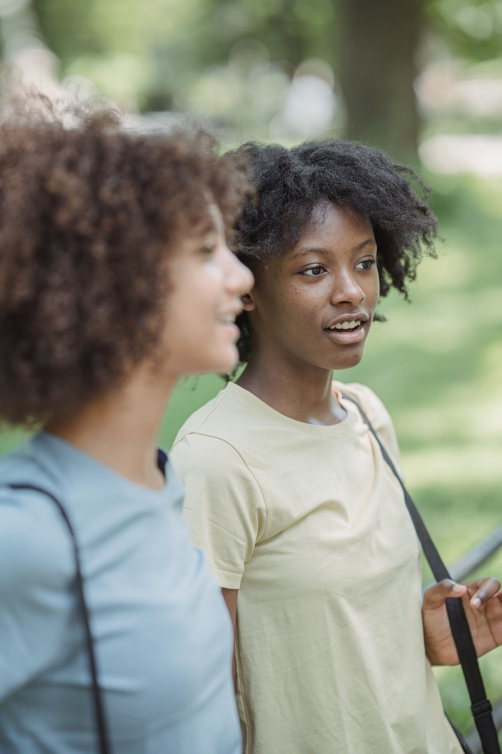 Two people talking outdoors during a supportive conversation